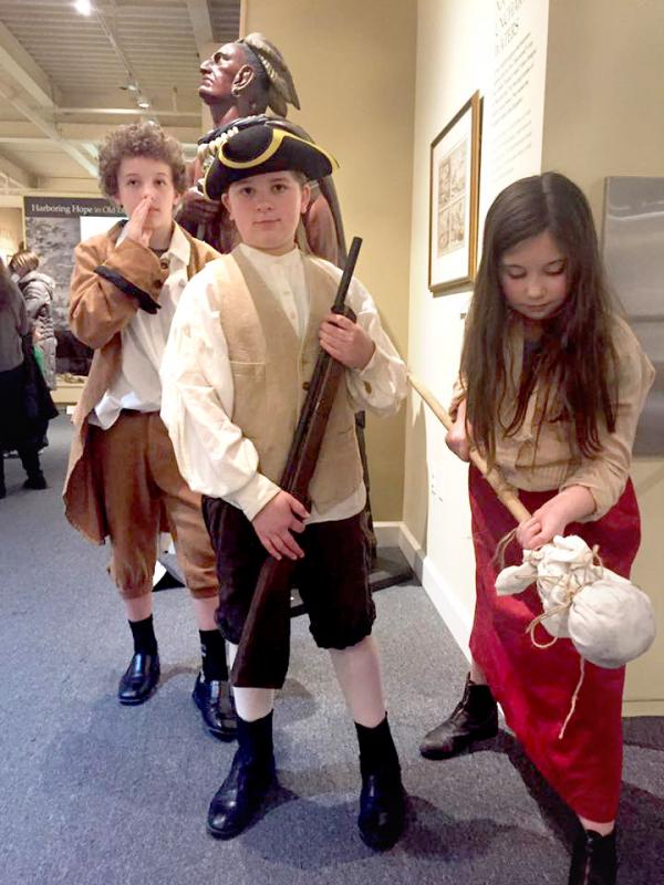 Fifth graders Mathew Merrikin, Frankie Selvaggio, and Maisie Lassalle portray Nathan Hale, Deborah Sampson, and Molly Pitcher, respectively. BY ANGIE HILSMAN
